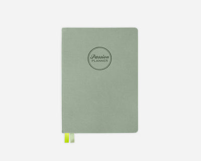 Green hardcover planner with 'Passion Planner' logo on a white background