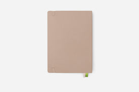 Beige notebook on a white background