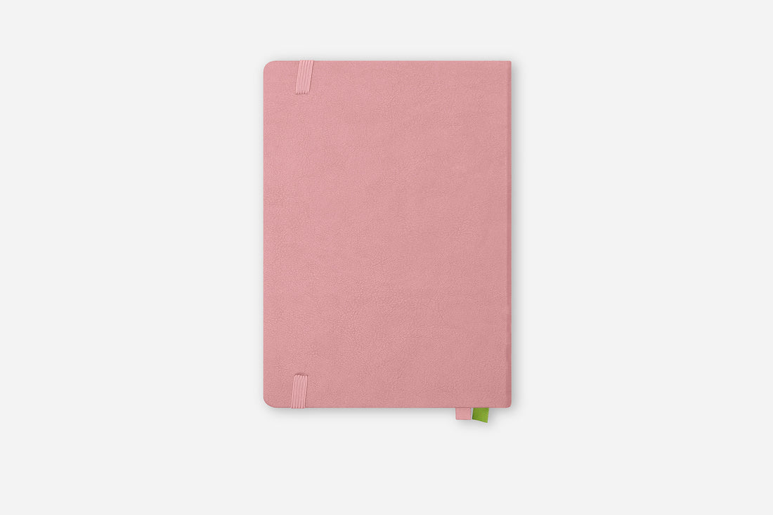 Pink notebook on a white background