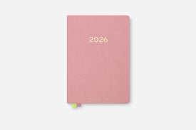 Pink planner with '2026' on a white background