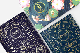 Three planner covers with celestial designs and 'Passion Planner' branding.