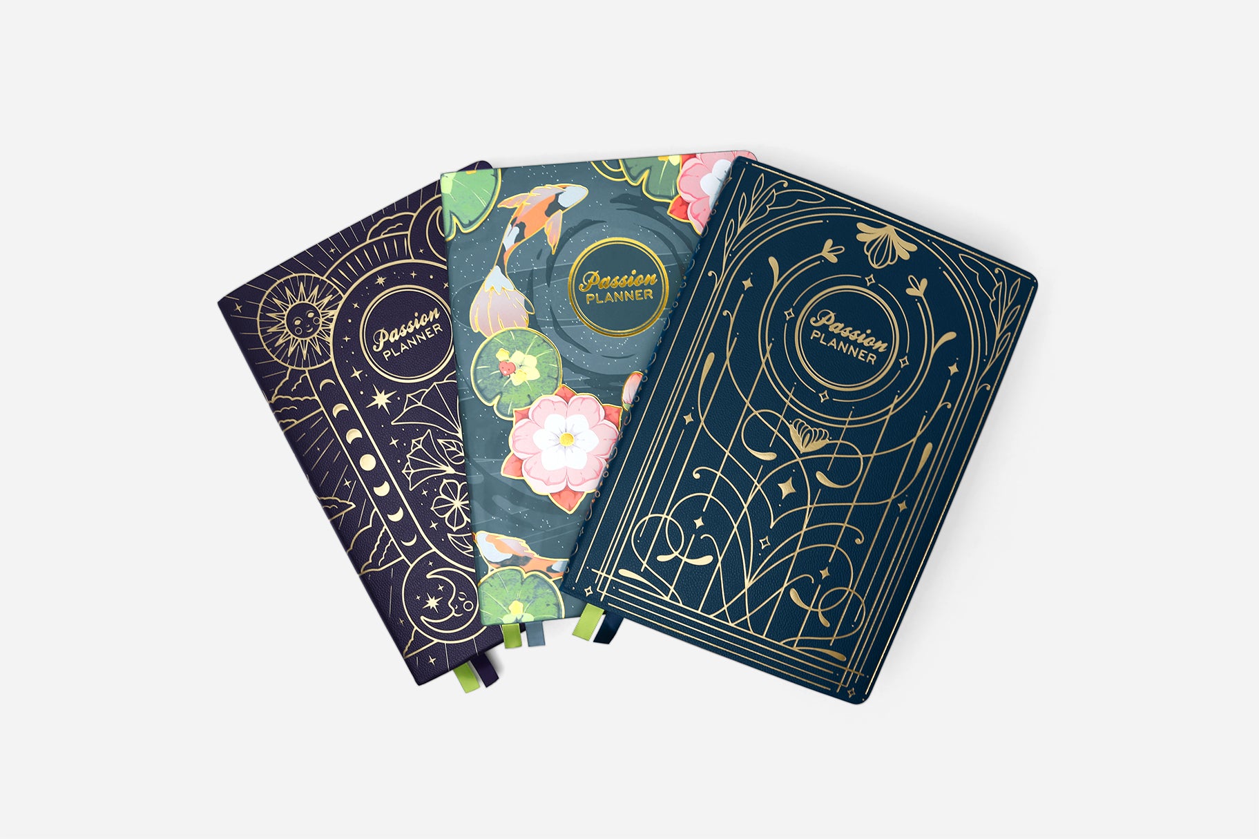 Three decorative planners with floral and celestial designs on a white background