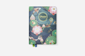 Planner with floral and koi fish design on a white background