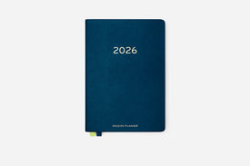 Navy blue hardcover planner with '2026' on a white background