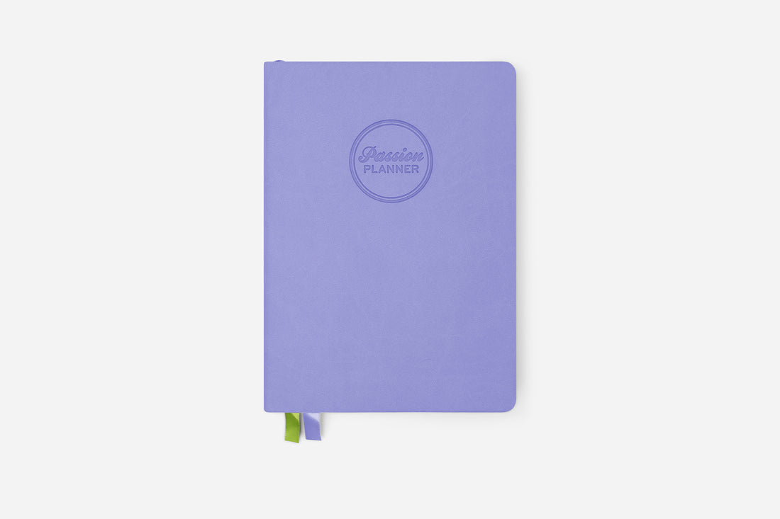 Purple planner with a Passion Planner logo on a white background
