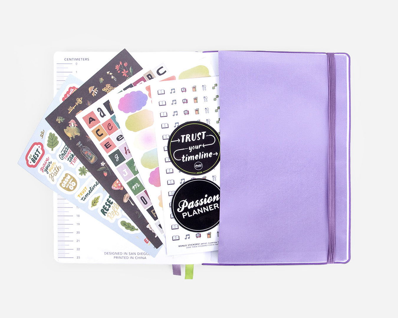 Purple pocket planner with free bonus stickers on a white background