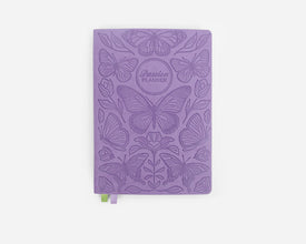 Purple planner with butterfly design on a white background