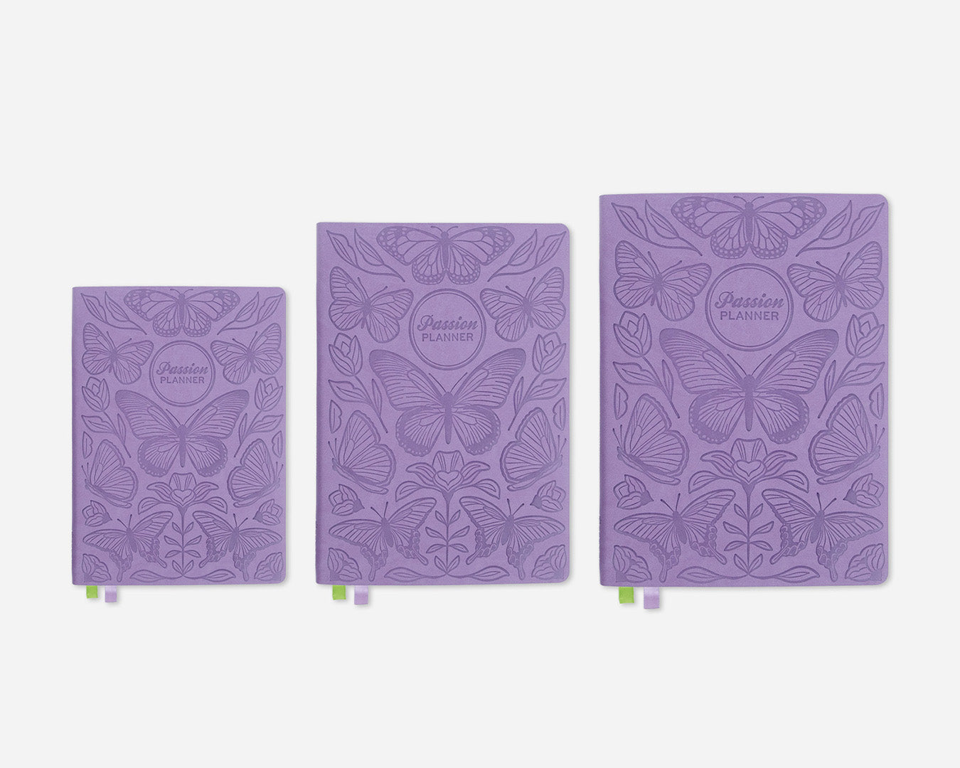 Three purple planners in different sizes with butterfly design on a white background