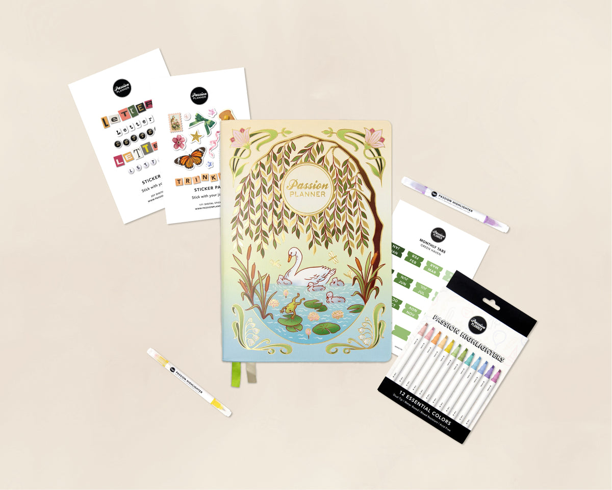 A stationery flat lay featuring a pastel illustrated planner titled 'Passion Planner' with a willow tree and swan design, surrounded by sticker sheets, two white pens, and a pack of colorful highlighter pens on a light beige background.