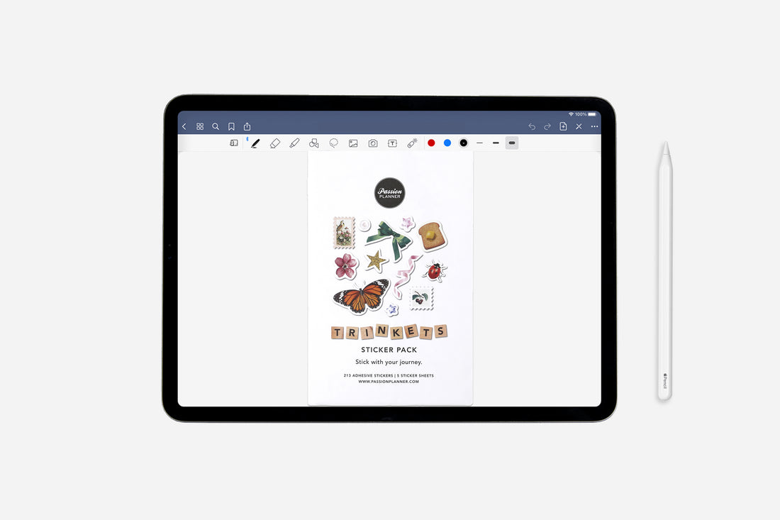 iPad displaying a trinkets sticker pack on a white background with a stylus next to it