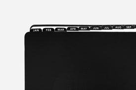 Black planner with month labels on a white background