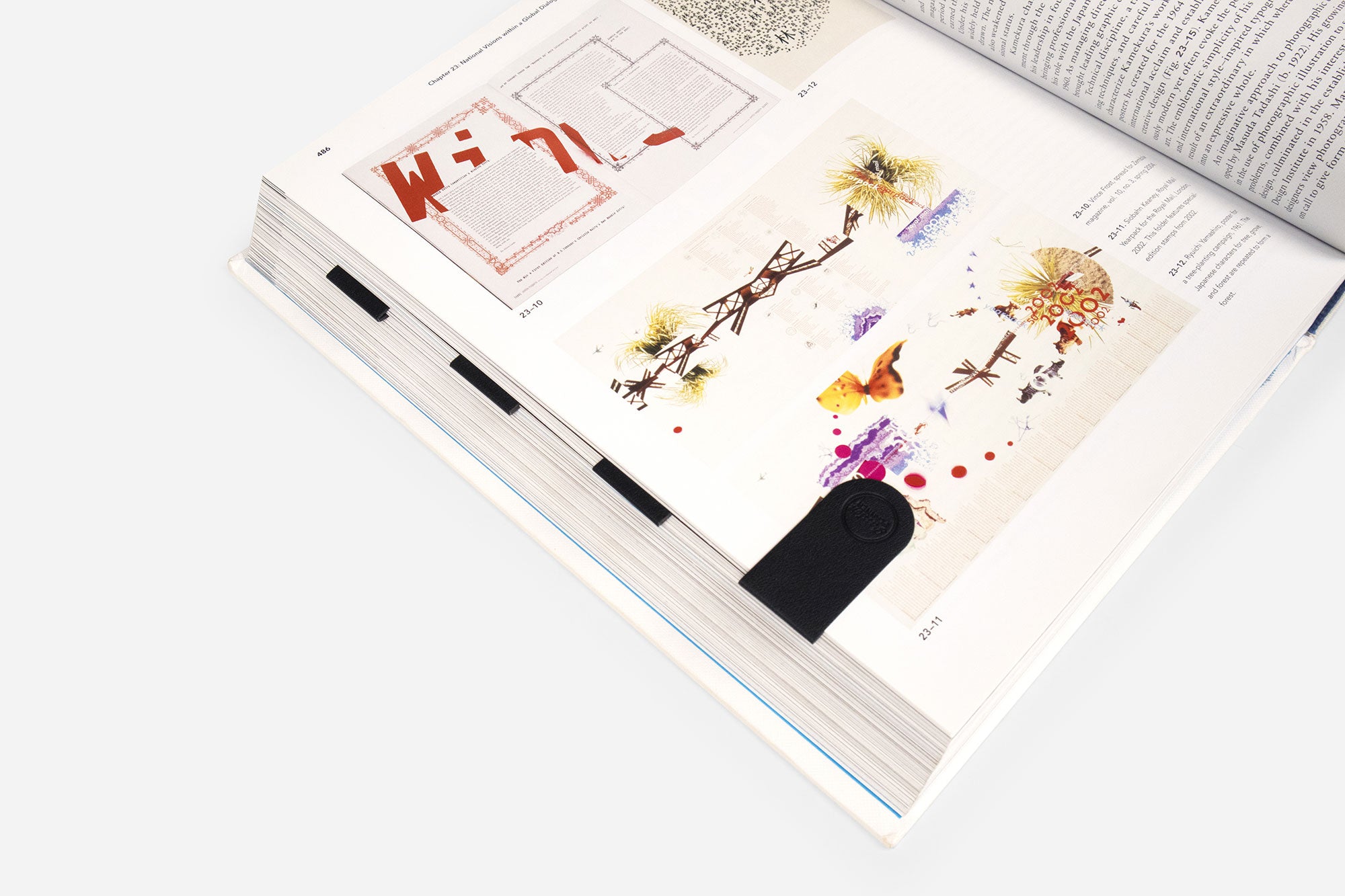 Open book with artistic illustrations with bookmarks on a white background