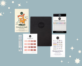 Collection of stationery items including a sticker book, a weekly planner, and highlighters on a blue background with stars.