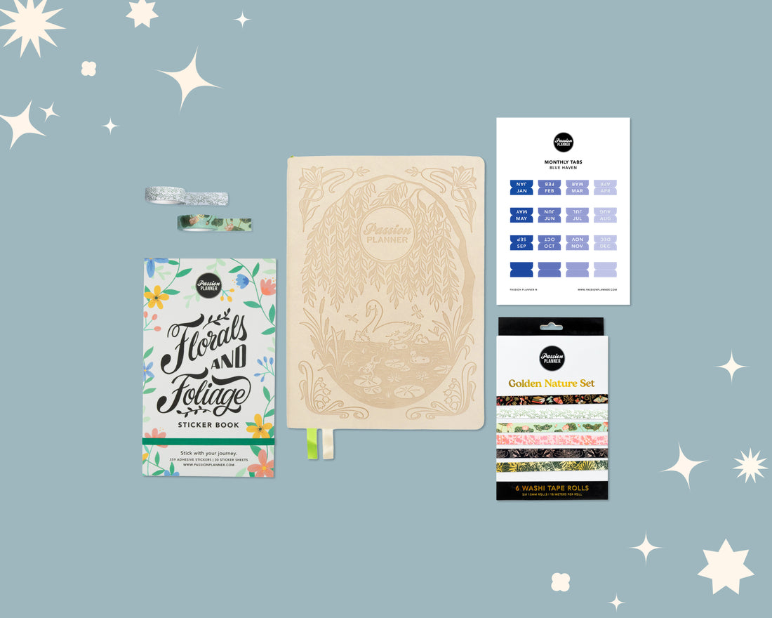 Collection of stationery items including a weekly planner, sticker book, and washi tape rolls on a light blue background with star decorations.