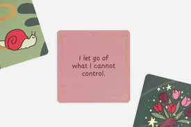 Pink affirmation card with motivational quote surrounded by other cards with designs and text.