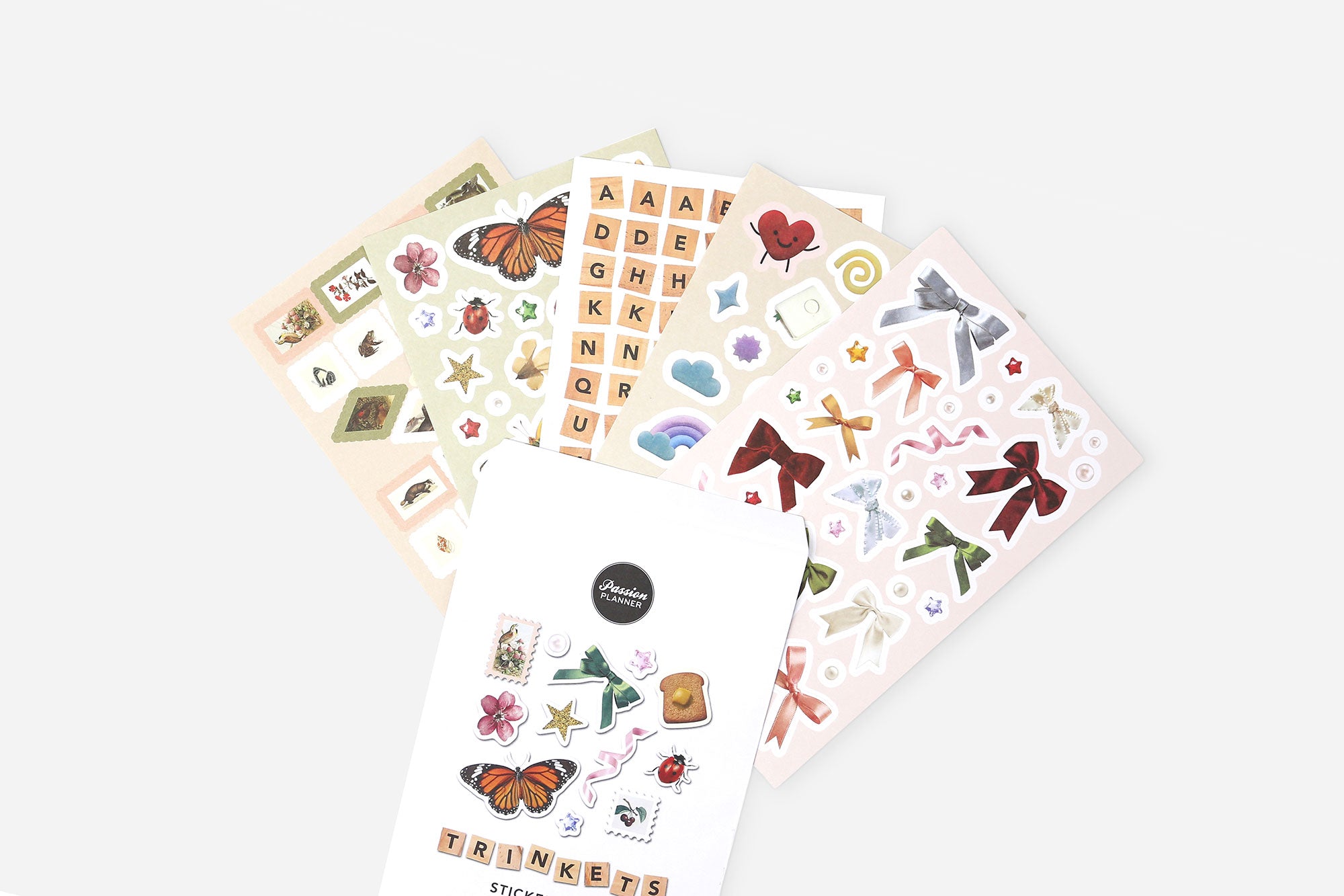 Collection of sticker sheets with various designs on a white background