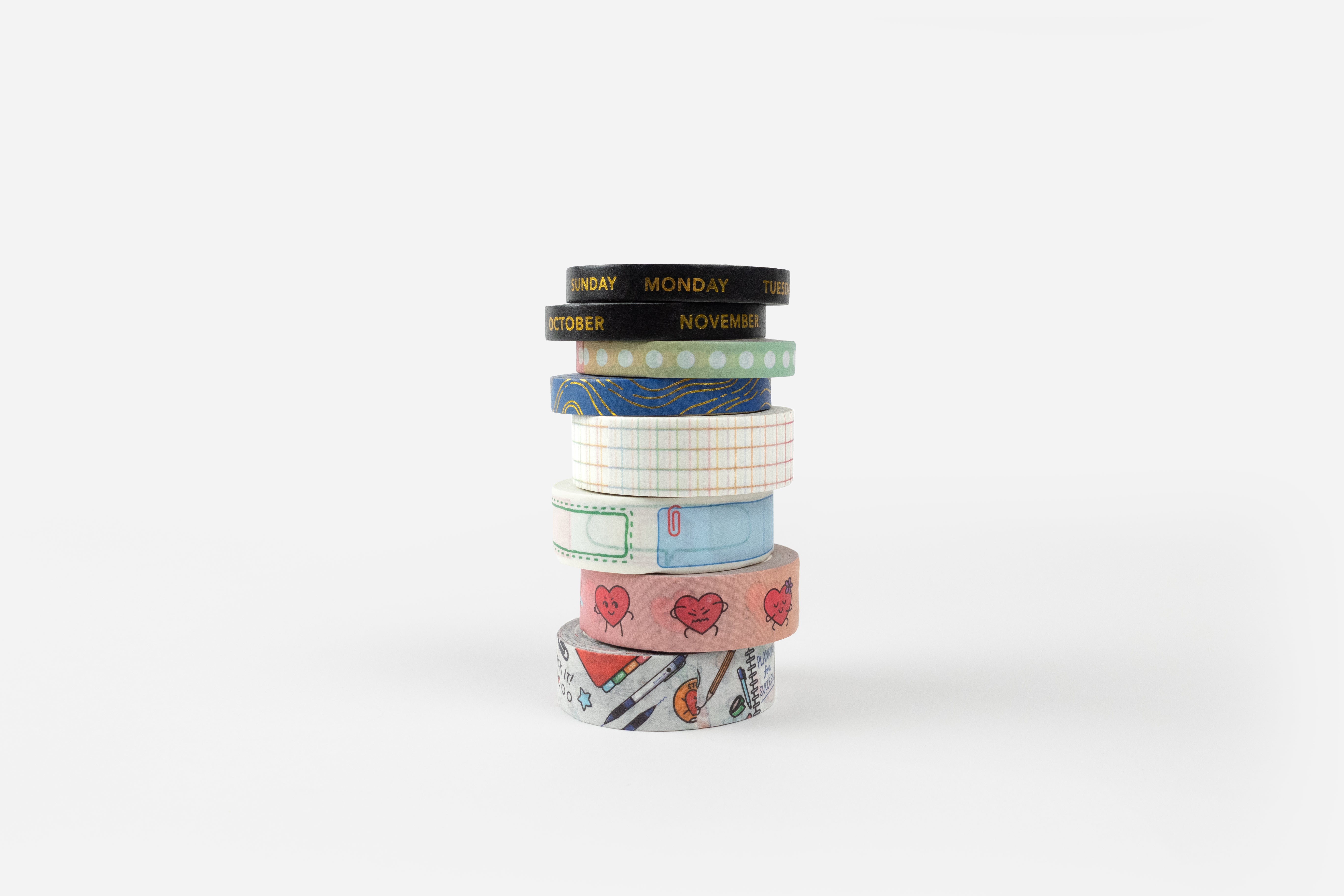 eight rolls of washi tape stacked