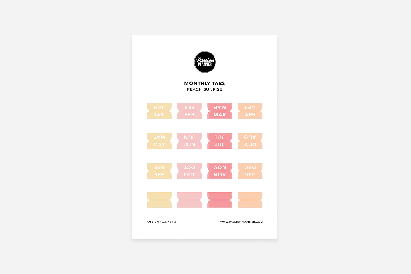 A sheet of peach pastel monthly tabs labeled with different months of the year, designed to be used in a planner.