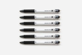 Six soft black pens lined up on a white background.